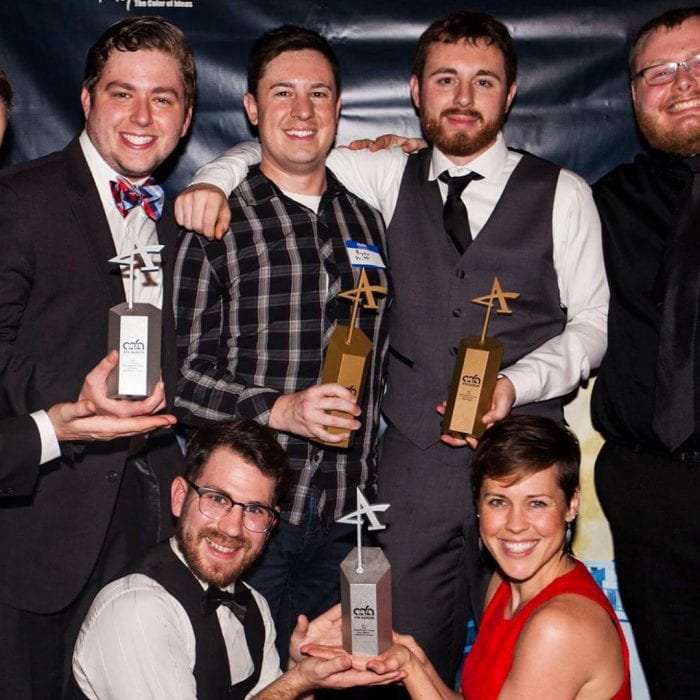 Video production team members at an award ceremony that recognizes video agencies for their work. The event was held in Akron, Ohio