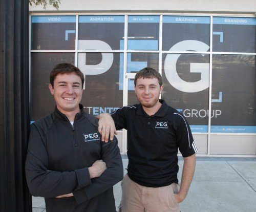Jeffrey And Ryan outside the first PEG office in downtown Akron